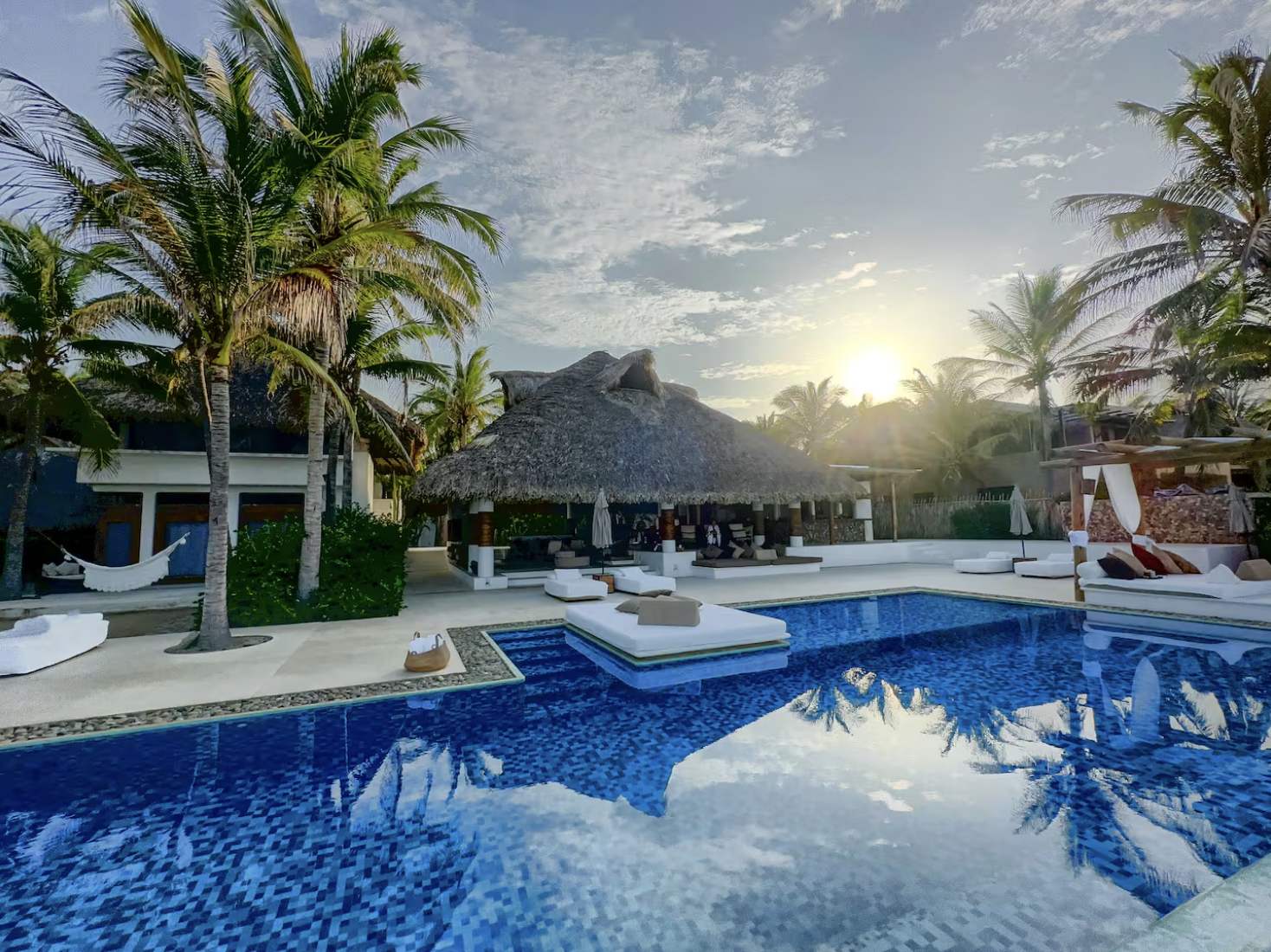 Villa 1 pool terrace and palapa pavilion under palms